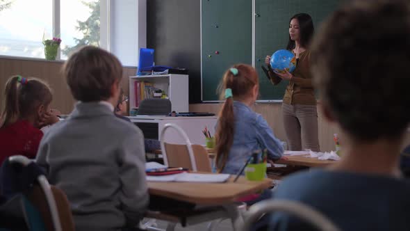 Pupils Studying Geography During School Lesson