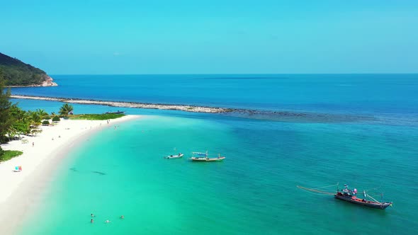 Tropical sandy beach with the turquoise calm sea in Thailand. Malibu beach, Koh Phangan