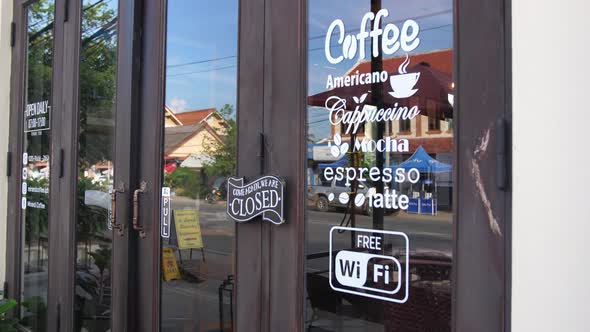 Closed Sign In Front Of Coffee Shop