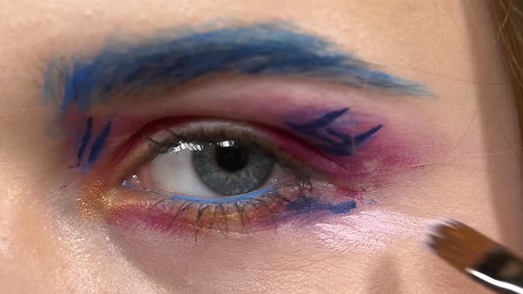 Make-up Artist Applying Light Paint on Model's Eye, Exotic Make, on White Close Up, Slow Motion