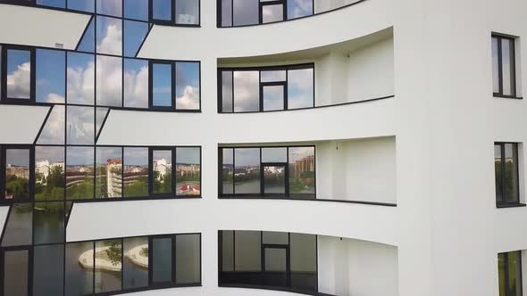 Many windows on new apartment building facade.