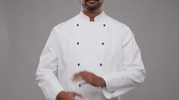 Happy Male Indian Chef in White Jacket 