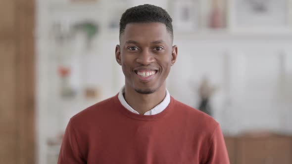 Portrait of African Man Smiling at Camera at Home