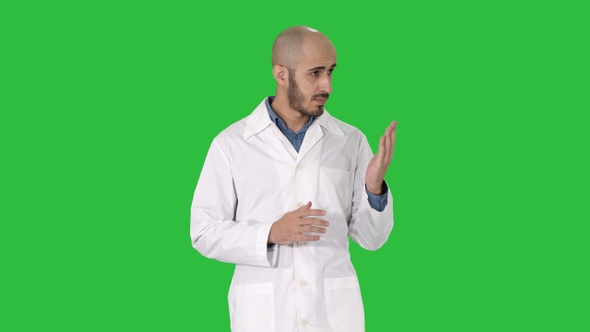 Middle age doctor man wearing medical uniform presenting