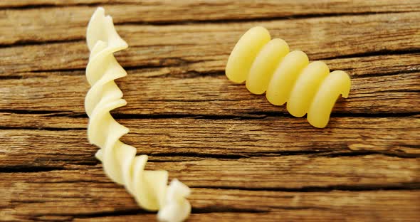 Various pasta on wooden table