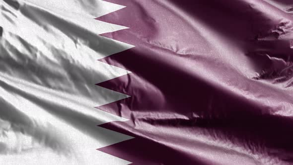 Quatar textile flag waving on the wind. Slow motion. 20 seconds loop.