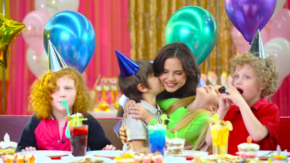 Children Celebrating Their Birthday with Mother and Fiends at Cafe