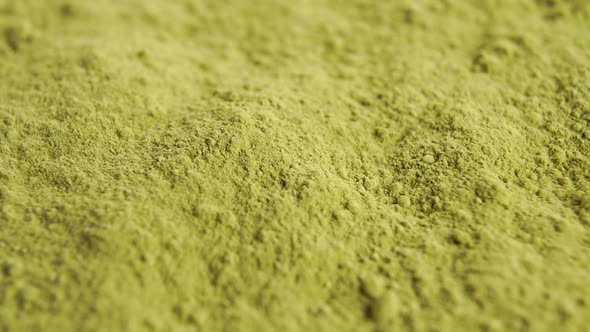 Heap of green matcha tea powder. Macro. Rotation