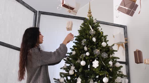 Positive Woman Indoors with Christmas Decoration