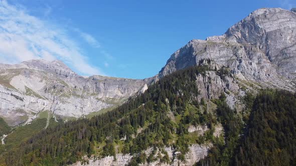 Flying sideways next to a mountain range in the french Alps. Nice fall colors.