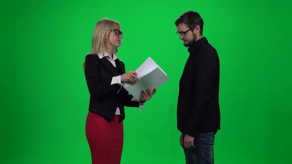 Business Partners Discussing Contract Terms Against Green Screen Chroma Key Background