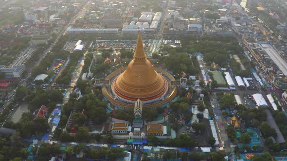 Aerial top view of Phra Pathommachedi temple at sunset in Nakorn Pathom district, Thailand.