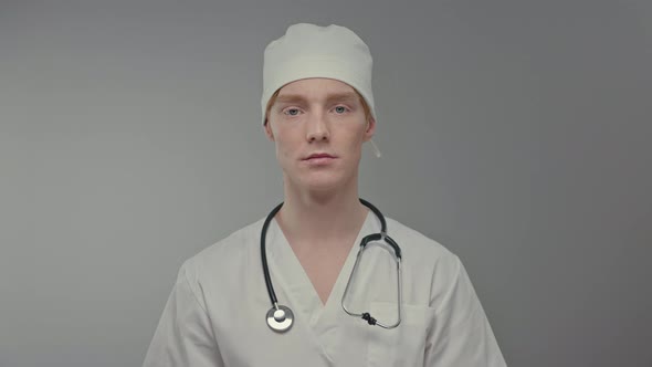 Face Of Young Doctor In White Hat