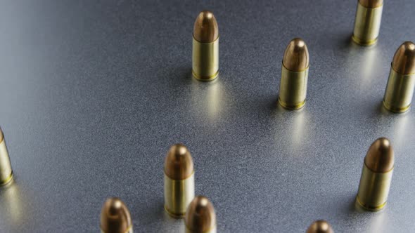 Cinematic rotating shot of bullets on a metallic surface - BULLETS 049