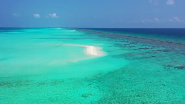 Aerial scenery of luxury island beach wildlife by transparent ocean with white sandy background of a