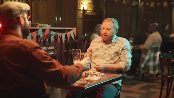 Bearded Men Drinking Beer In Pub