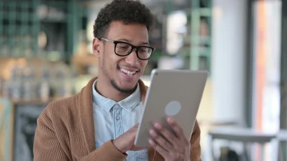 Young African Man Using Digital Tablet