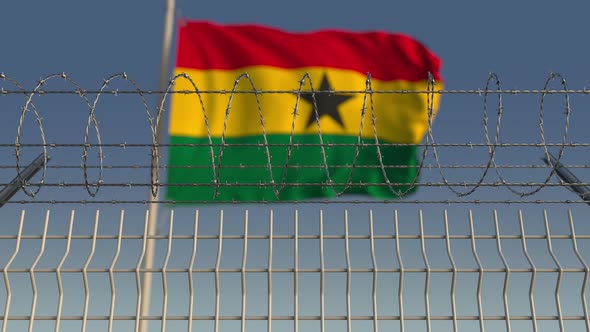 National Flag of Ghana Behind Barbed Wire Fence