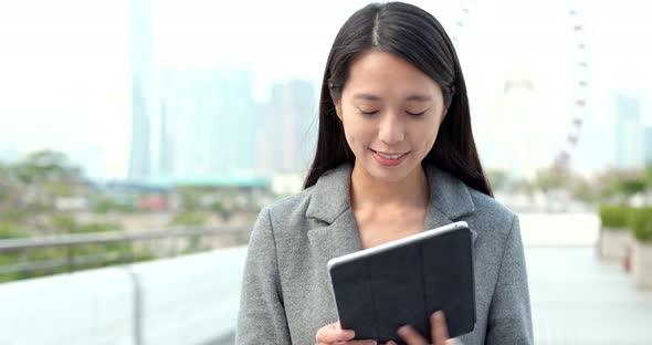 Woman working on tablet computer