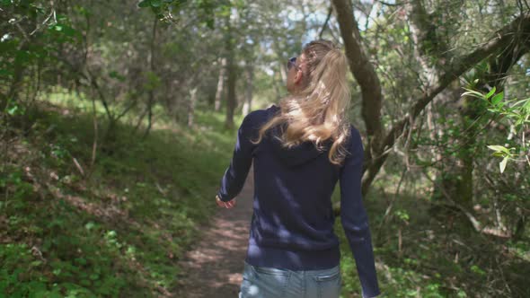 Girl Hiking In The Forest