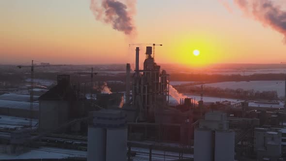 Aerial View of Cement Factory Tower with High Concrete Plant Structure at Industrial Production Area