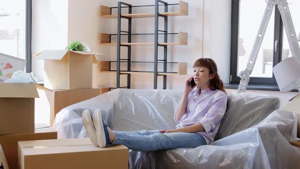 Happy Woman Calling on Phone Moving to New Home