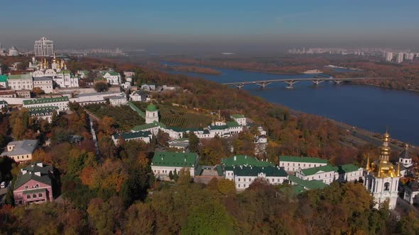 Beautiful, morning flight over the Kiev Pechersk Lavra. Autumn in Kiev. Yellow, red trees.