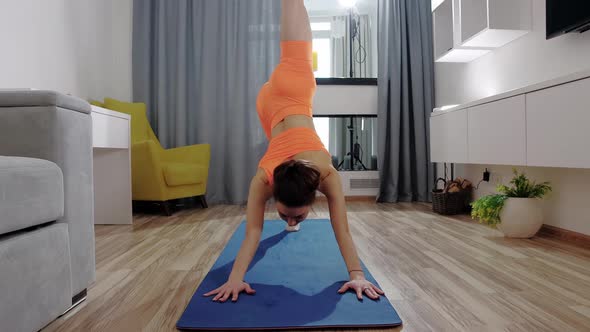 Fitness at Home  Young Woman Doing Fitness Exercises on Yoga Mat