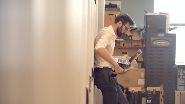 Male It Technician Engineer With Tablet Work In Server Room In Data Center.