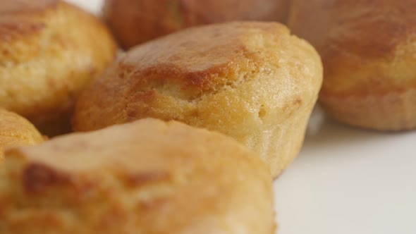 Golden color cornbread shaped as a muffin slow pan 4K 2160p 30fps UltraHD footage - Panning over  co