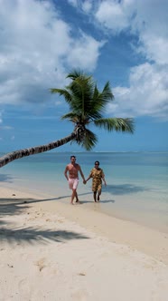 Anse Takamaka Beach Mahe Seychelles Tropical Beach with Palm Trees and a Blue Ocean Couple Man and