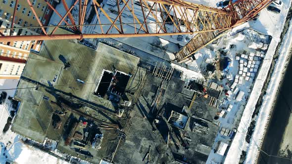 Crane Works on Construction Site Near Building