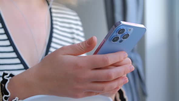 Femaly using new mobile phone for communication online in 4k stock footage