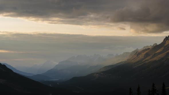 Light Beams Illuminating Mountain Peaks at Sunset in Valle