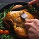 Fried Chicken or Turkey Cut By the Hands of a Person with Green Herbs in an Iron Dish - VideoHive Item for Sale