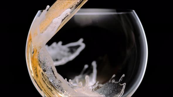 Pouring beer into glass. Slow Motion.