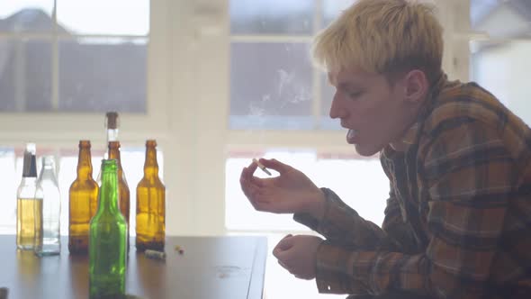 Portrait Trouble Teen Man Smoking Cigarette at Home