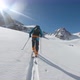 Man Skiing Uphill in High Snowy Mountains - VideoHive Item for Sale