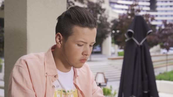 Young man having a coffee break.