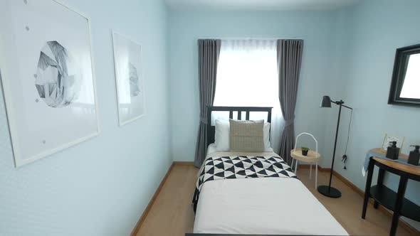 Cosy Black and White Bedrrom with Single Bed decorated with Stylish Furnitures