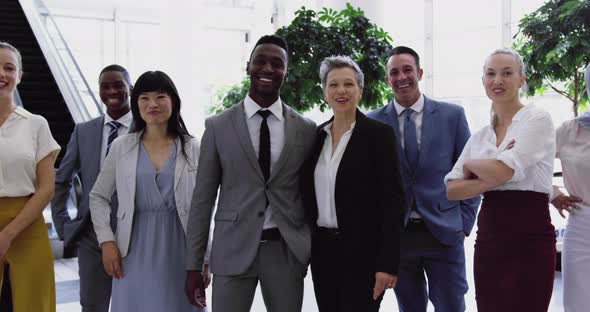 Business people standing together in the lobby at office 4k