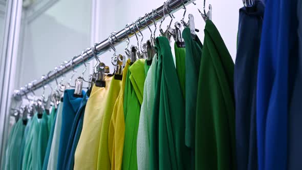 Factory Samples of Multicolored Fabrics Hang on a Hanger