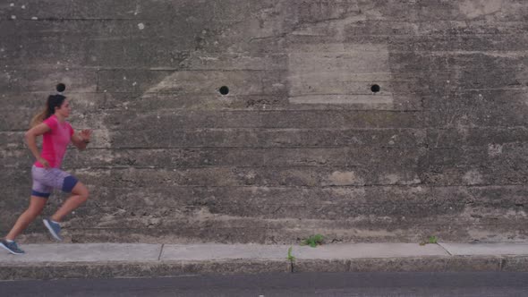 Caucasian woman running on the street