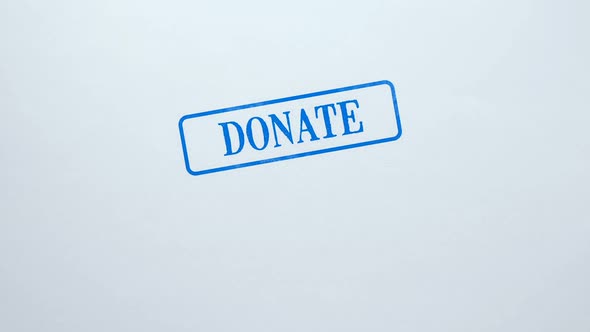 Donate Blue Seal Stamped on Blank Paper Background, Charity Project, Kindness