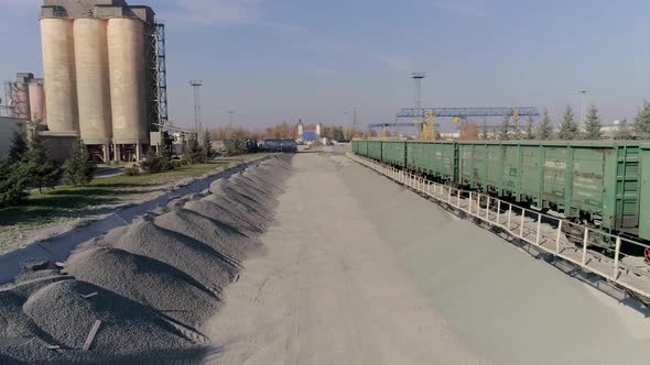 Aerial View at Heavy Construction Equipment on Hub of Construction Logistics alt