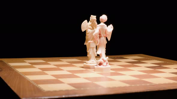 Chess pieces, King and queen head to head in the center of Chessboard, Game Concept