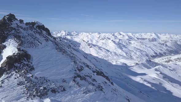Flying above the peak of Val Thorens's mountain, in the French Alps