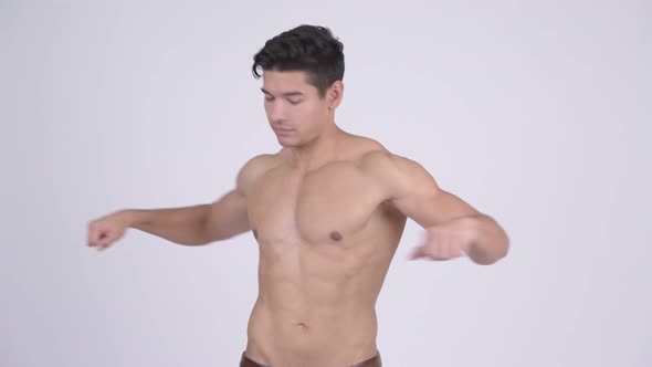 Young Handsome Muscular Shirtless Man Stretching