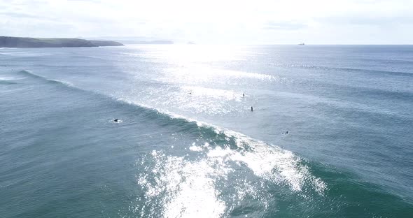 Surfers catching waves in ocean