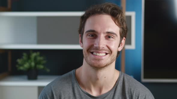 Portrait of Positive Man Face Looking Camera Indoors. Smiling Handsome Young Male Businessman in